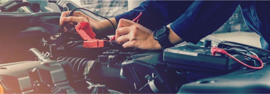 automotive expert working under a car